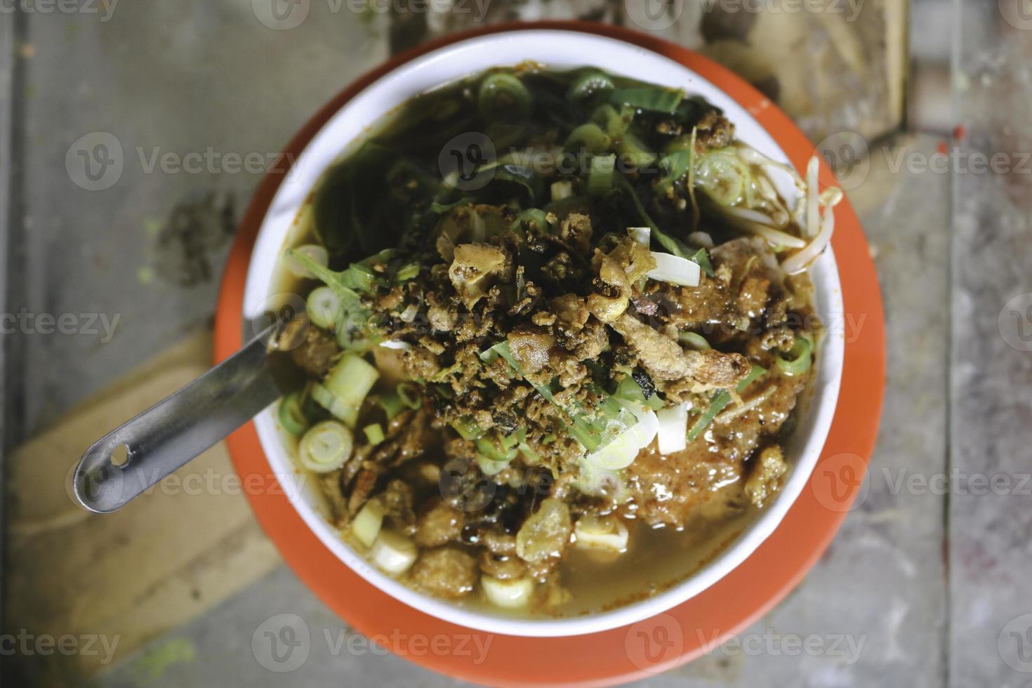 Soto Tauco from fermented soy bean and soto. Original from Tegal, Indonesia. Selective Focus photo