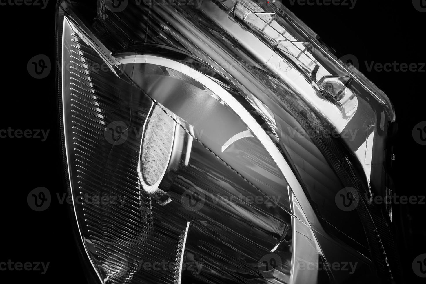 closeup of car lights on a black background isolated. trimmed car headlight photo