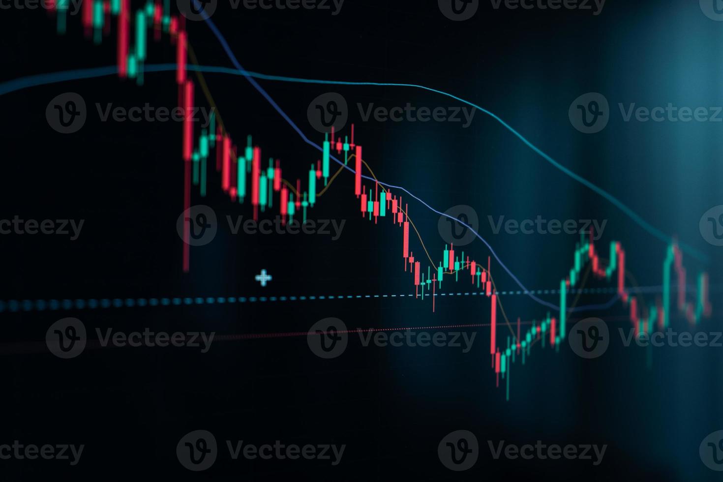 Crypto coins and graphs in the computer screen photo