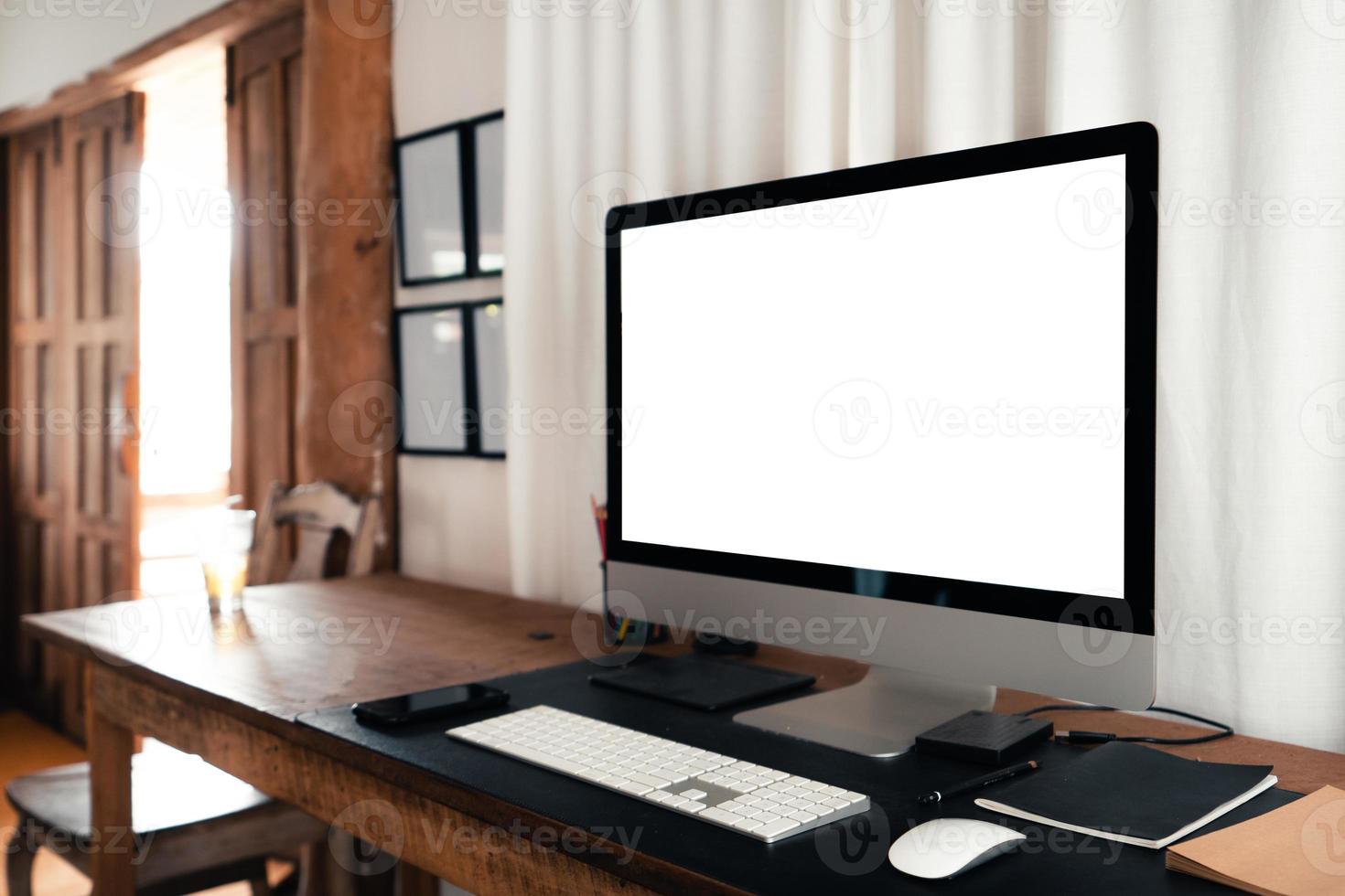 home office desk,Computer screen on a wooden table in the house photo