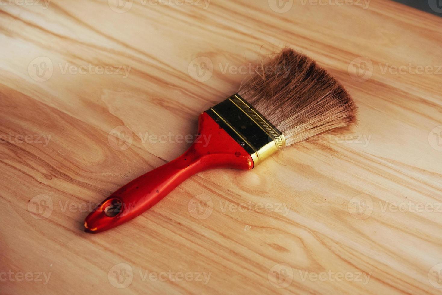 Brush isolated on wooden board photo