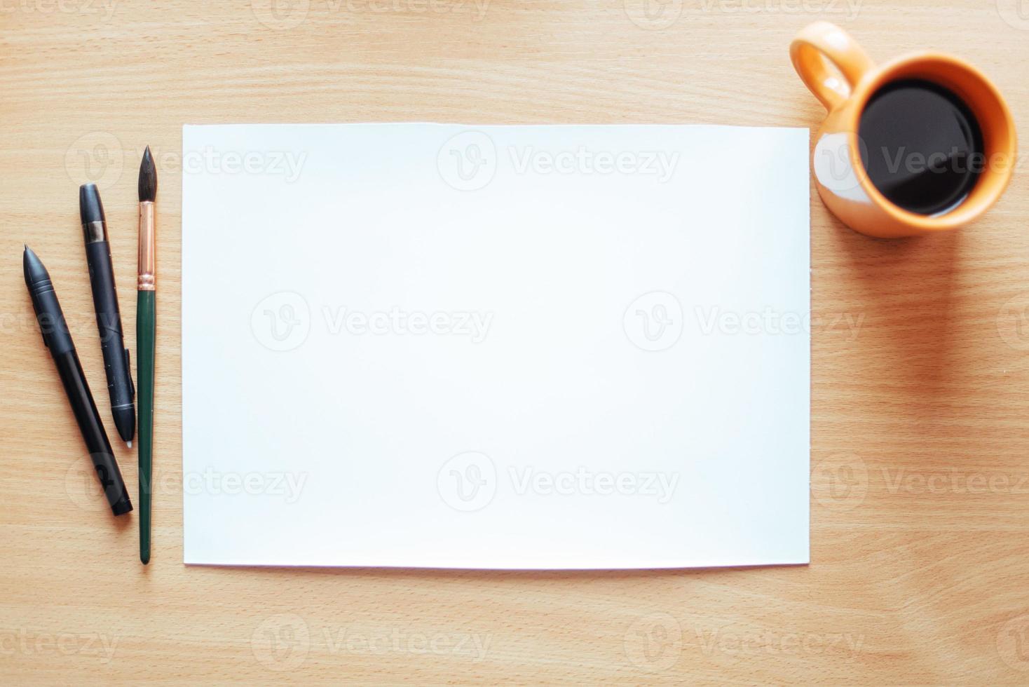 white empty sheet with lots of stationery objects makes photo