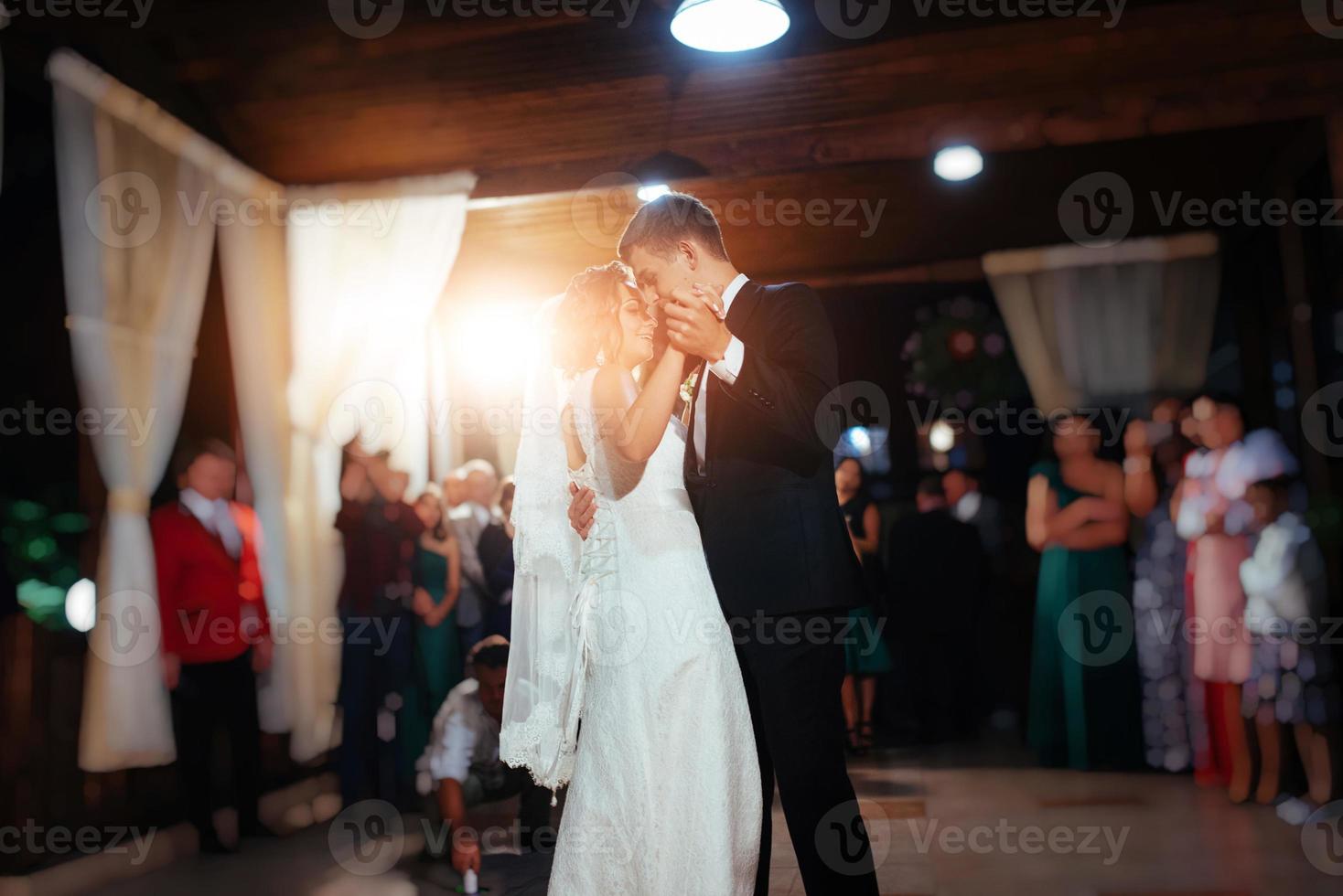 Happy bride and groom a their first dance, wedding photo