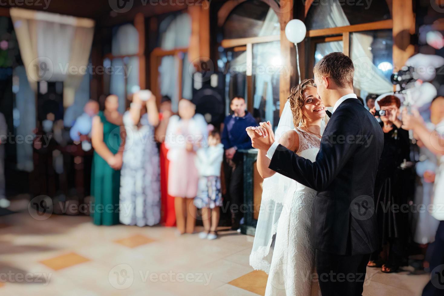 Happy bride and groom a their first dance, wedding photo