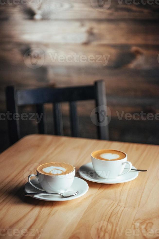 Two cups of gourmet coffee house cappuccino photo