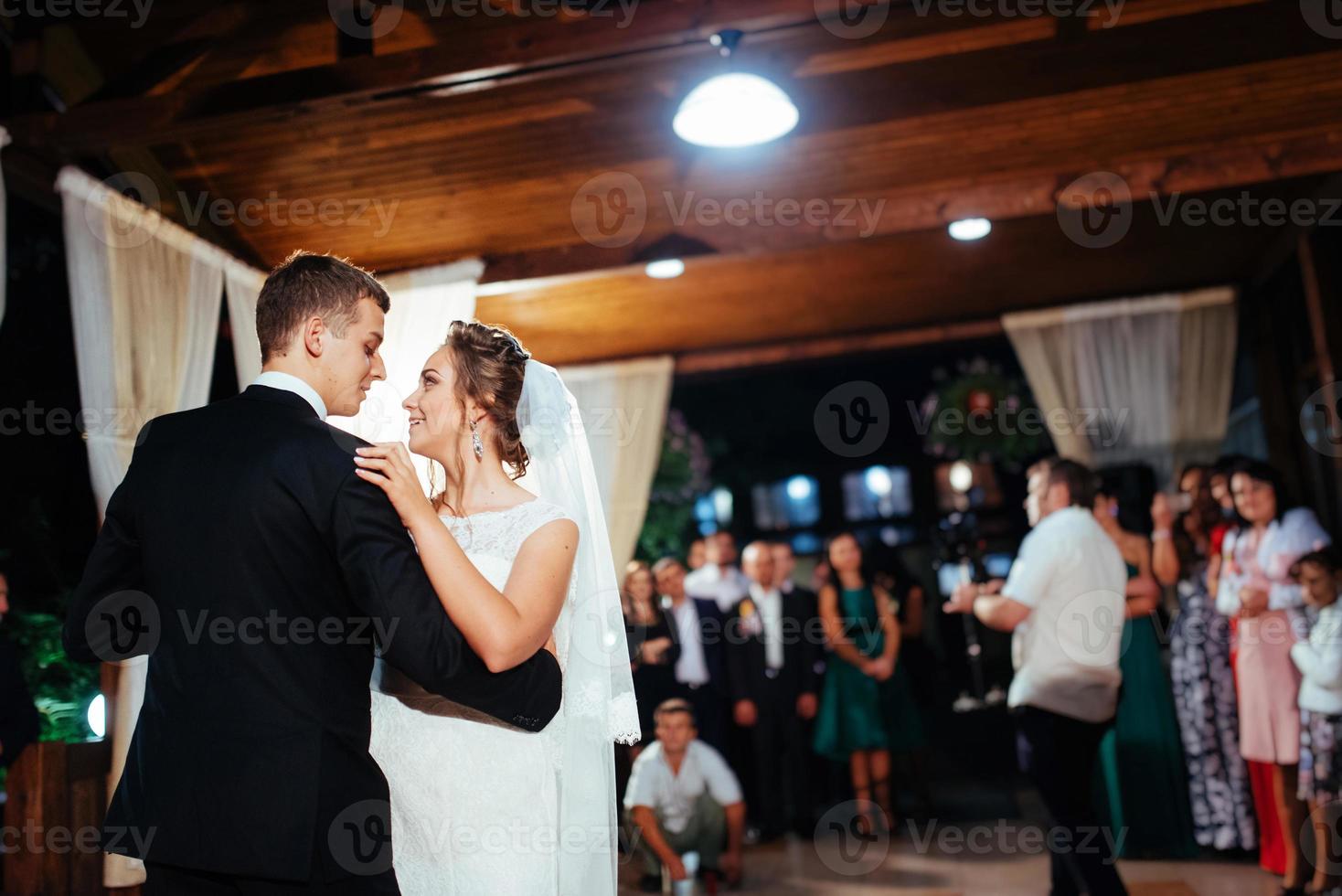 Happy bride and groom a their first dance, wedding photo