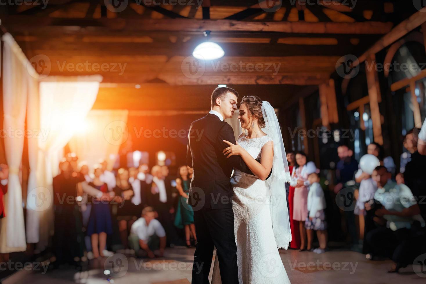 Happy bride and groom a their first dance, wedding photo
