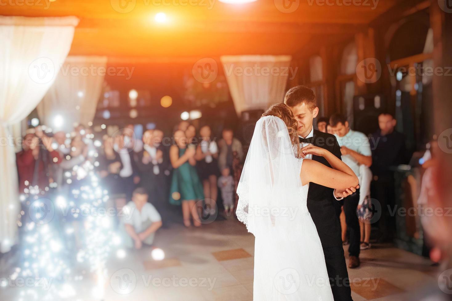 Happy bride and groom a their first dance, wedding photo