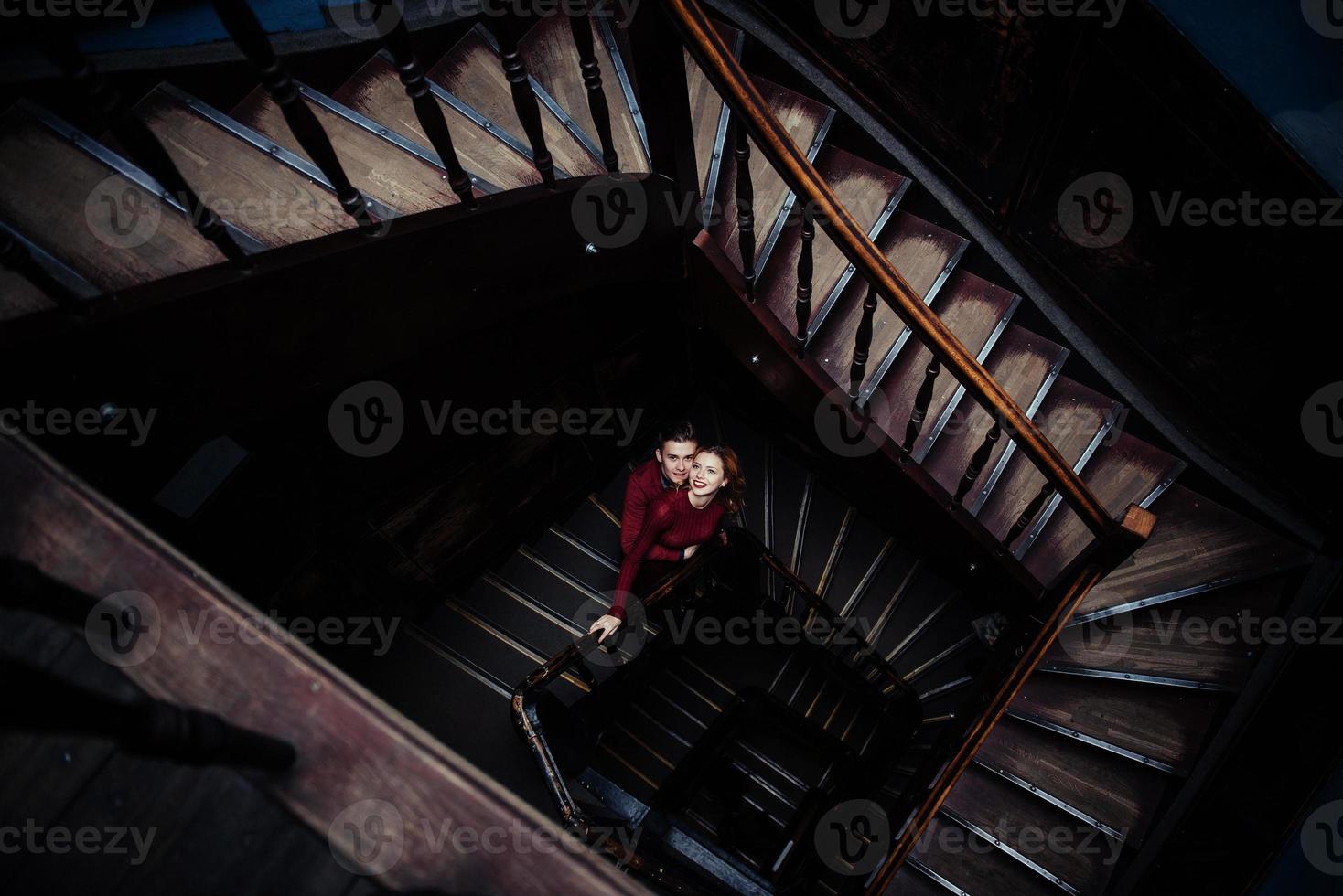 couple of young people on the wooden stairs photo