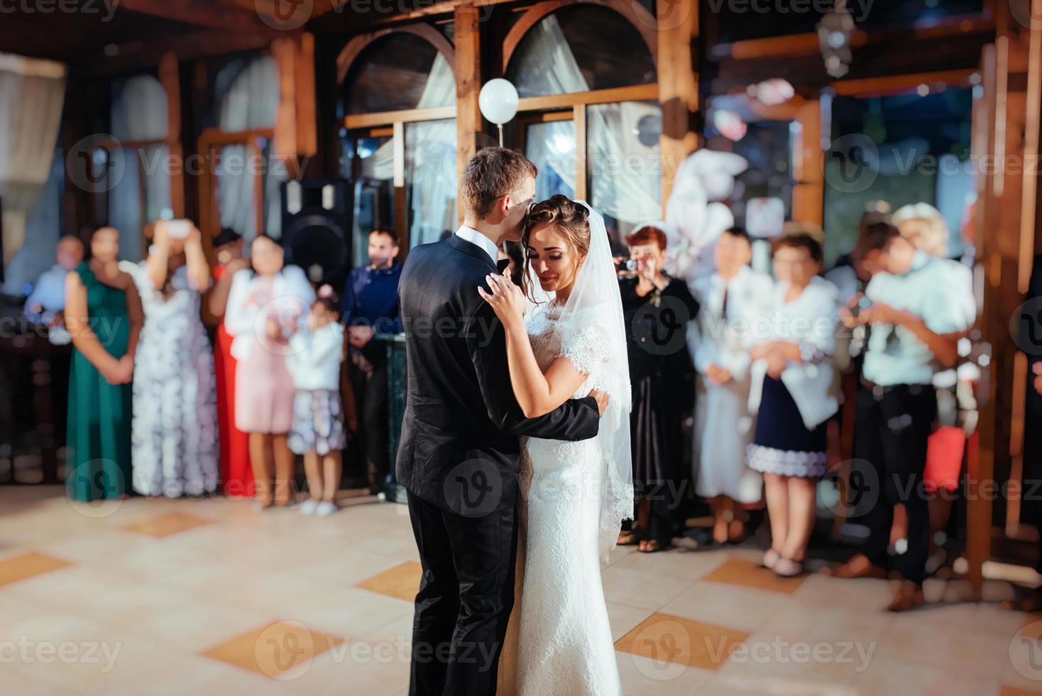 Happy bride and groom a their first dance, wedding photo