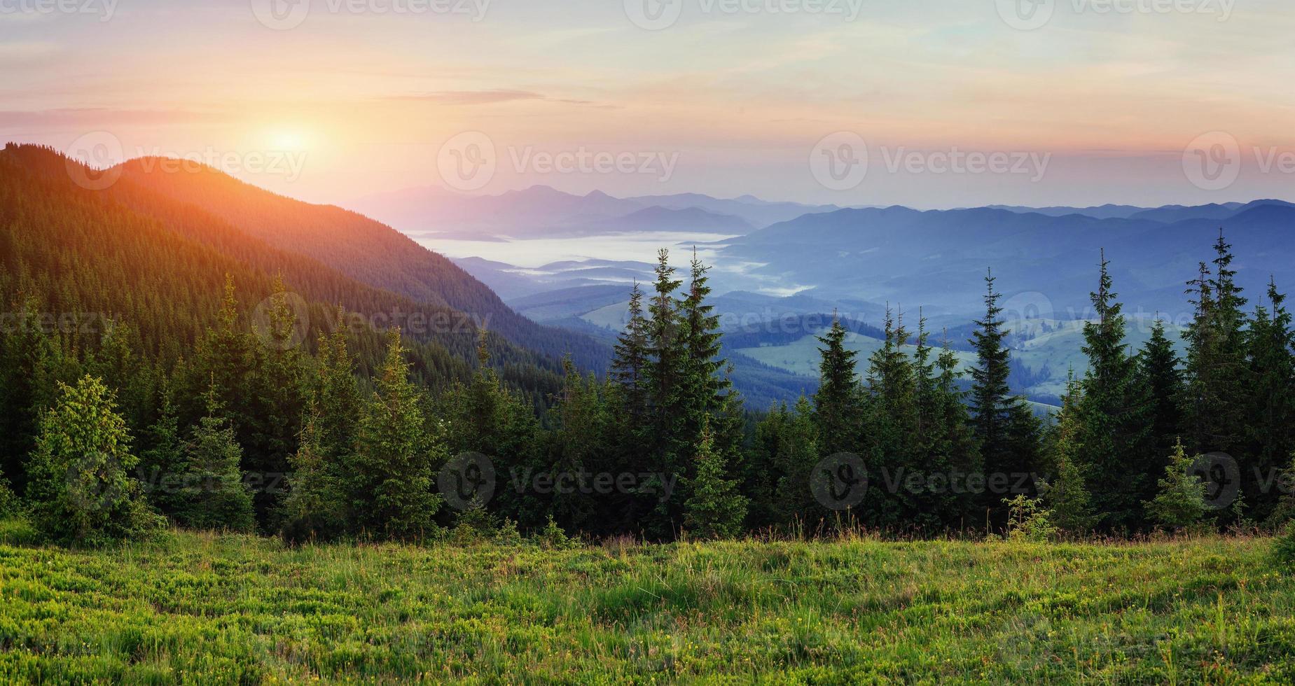 Landscape with fog in mountains sunset. photo