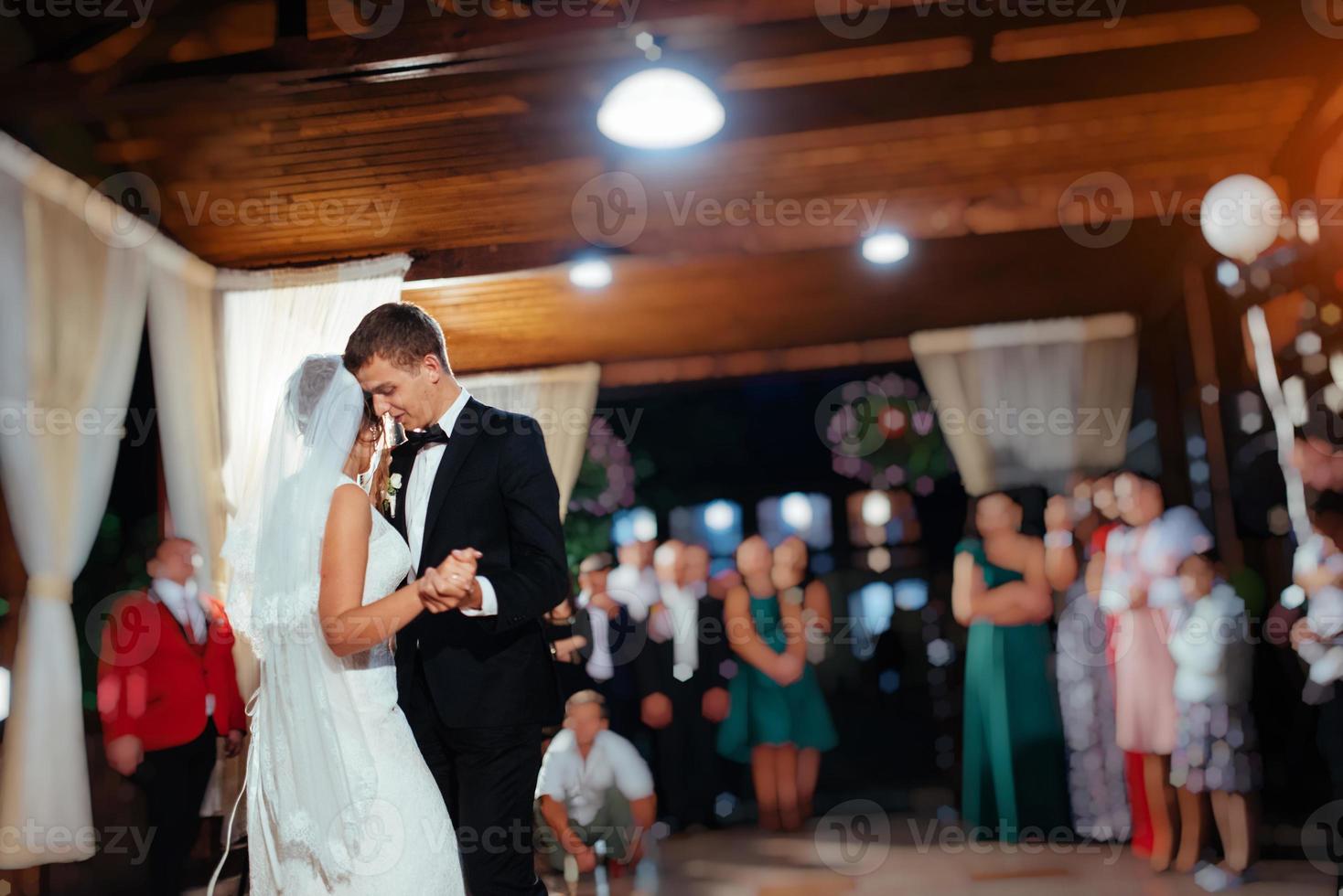 Happy bride and groom a their first dance, wedding photo