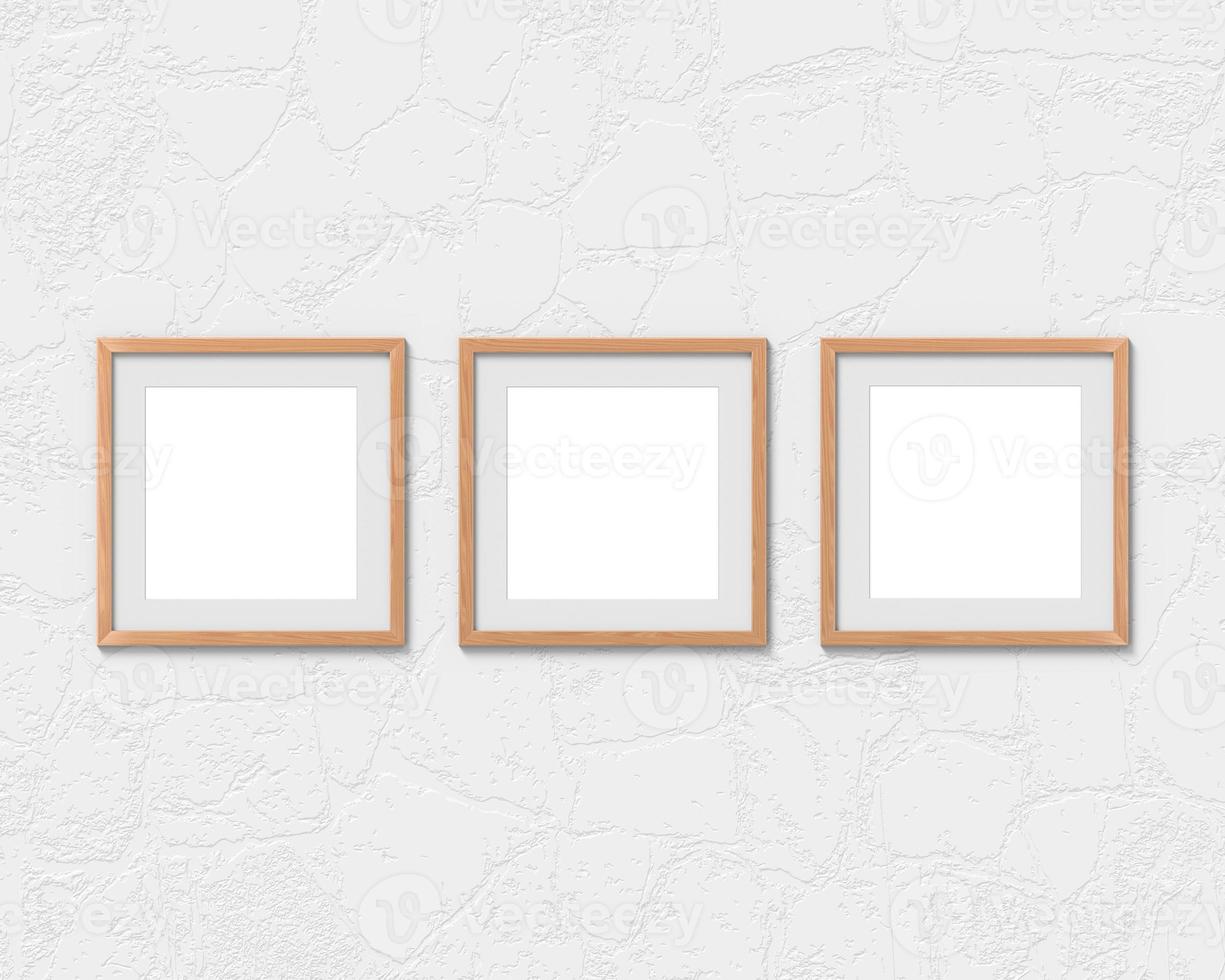 Set of 3 square wooden frames mockup with a border hanging on the wall. Empty base for picture or text. 3D rendering. photo