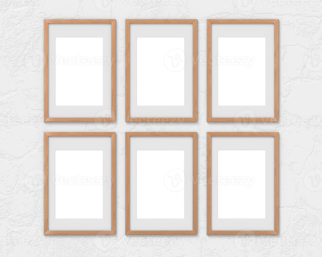 Set of 6 vertical wooden frames mockup with a border hanging on the wall. Empty base for picture or text. 3D rendering. photo