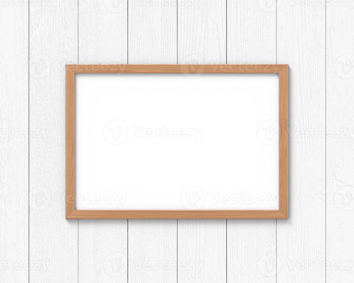 Horizontal wooden frames mockup hanging on the wall. Empty base for picture or text. 3D rendering. photo