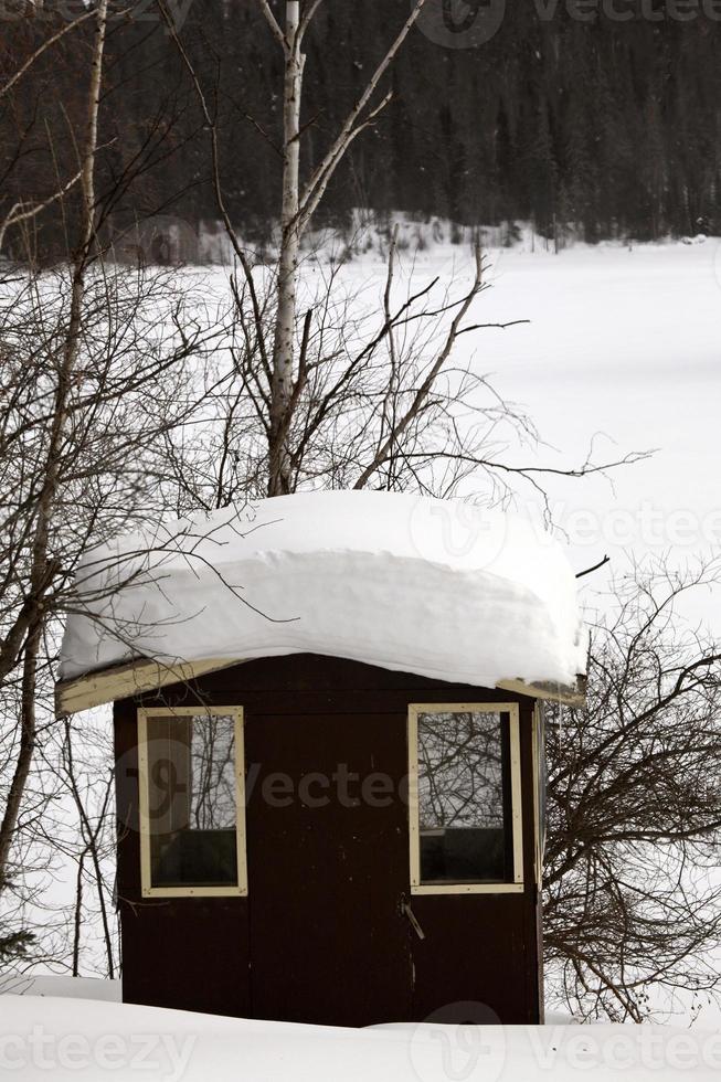 roof of shelter packed with snow photo