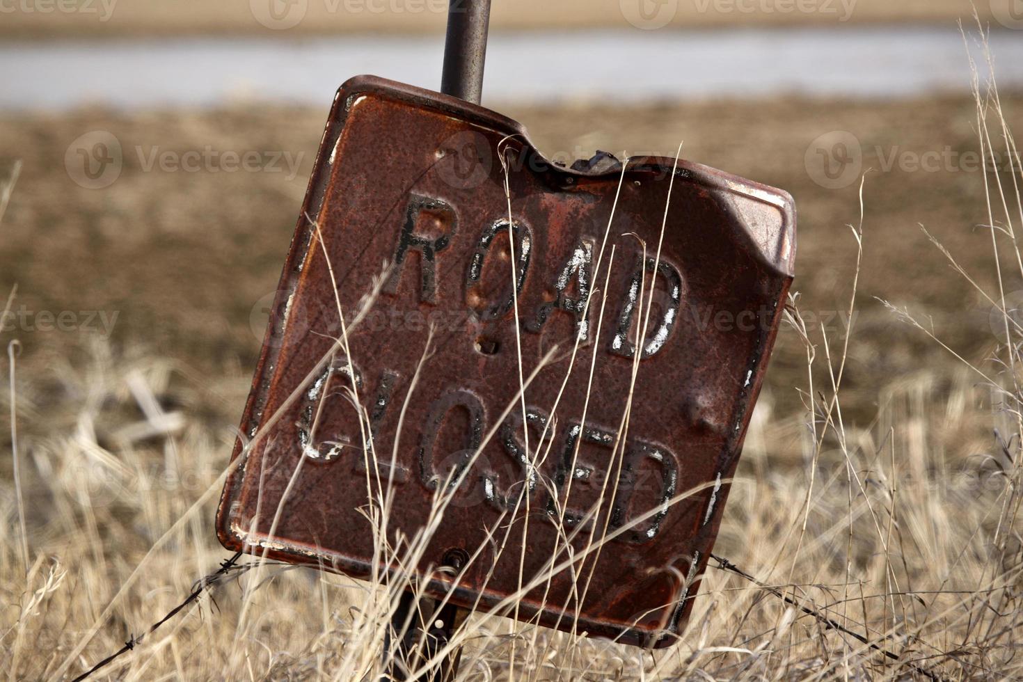 Old rusted road sign photo