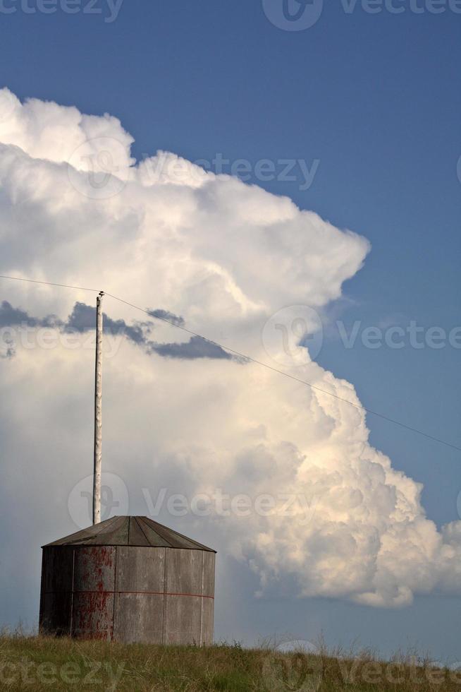 Thunderhead forming over an old Saskatchewan granary photo