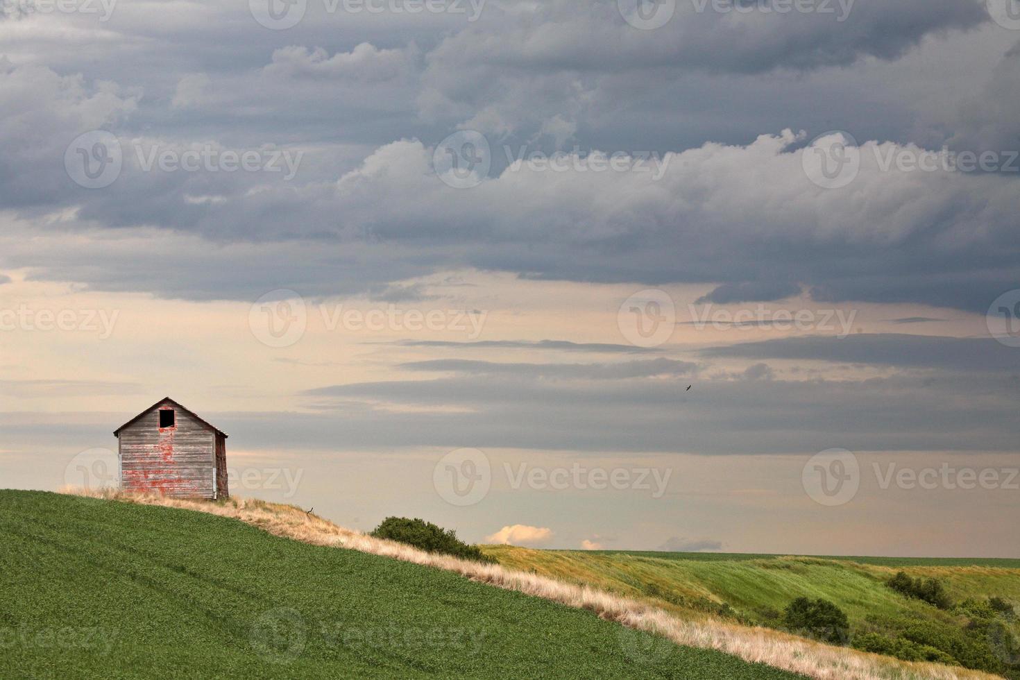 Cloudy skies over an old Saskatchewan granary photo