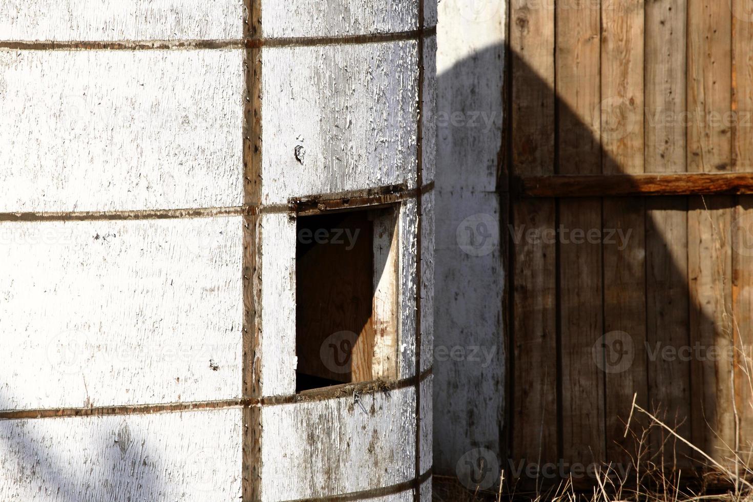 granary beside board fence photo