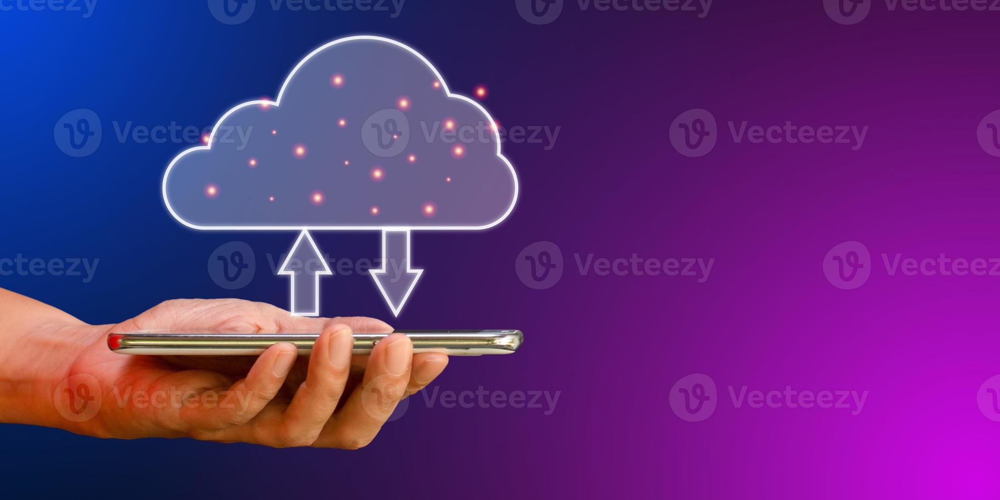 Cloud data storage concept. Hand hold cloud computing with transfer arrow on blue and purple background. Communication of business and financial. Large database and synchronize with the internet. photo