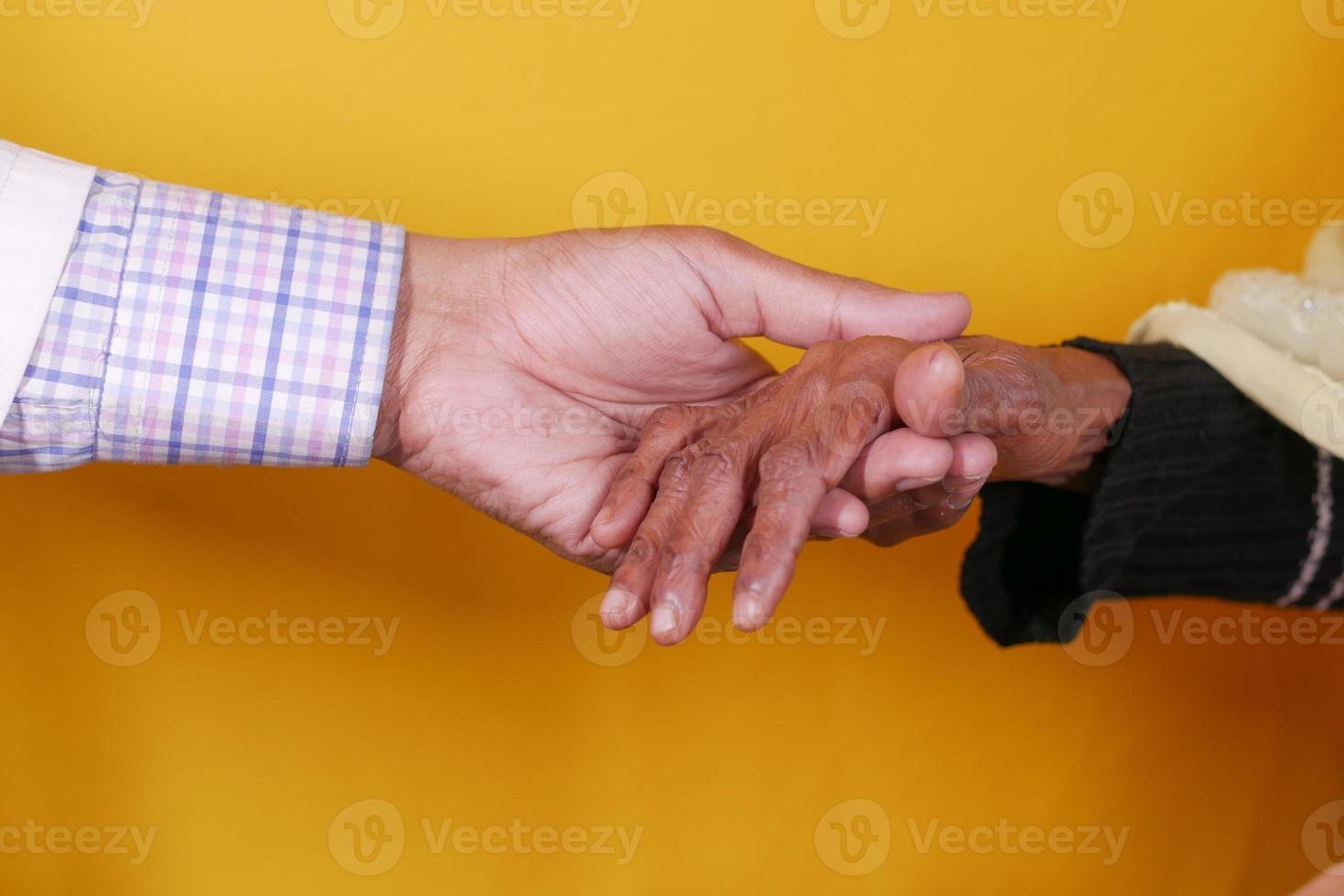 doctor holding hand of a senior women photo