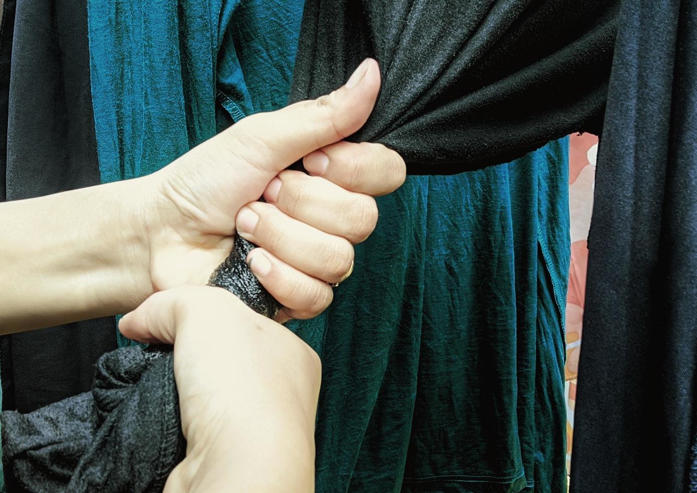 Both hands are wringing clothes to dry quickly.  Illustration of washing and drying clothes for household activities. photo