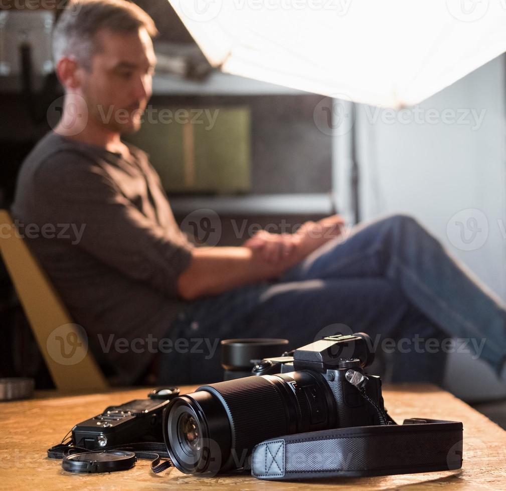 camera and equipment on the table in the Studio in the background of the sitting photographer photo