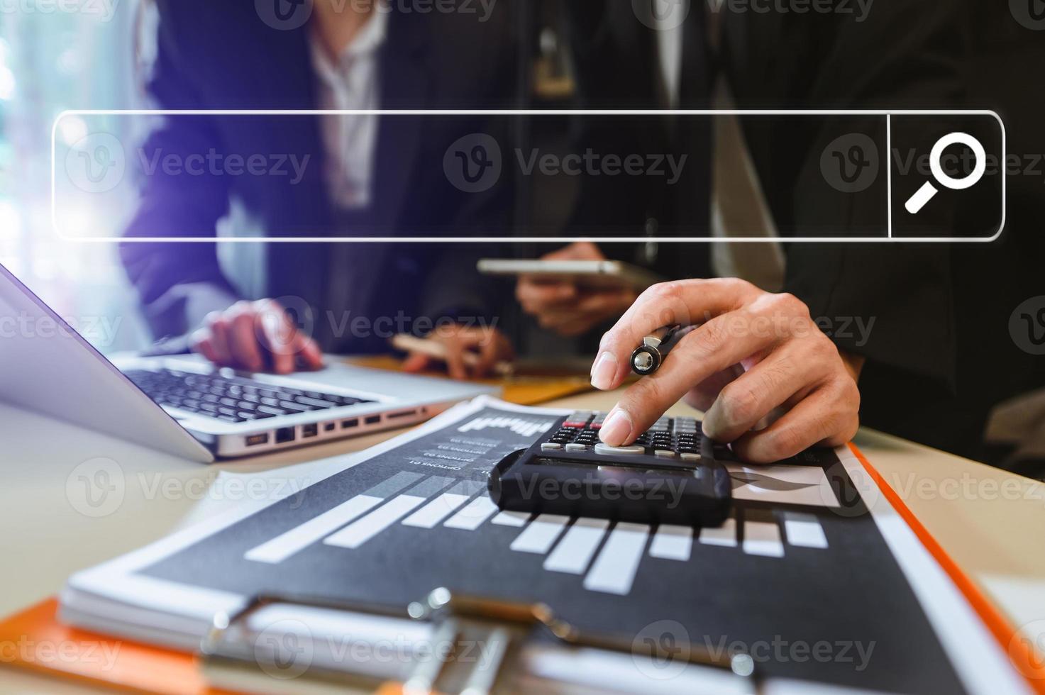 Searching Browsing Internet Data Information Networking Concept. two businessman hand using smart phone,mobile and tablet in office. photo