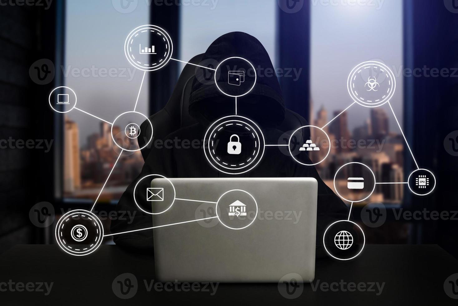 Hacker using computer with digital interface while sitting at desk of blurry interior. Hacking and thief concept. photo