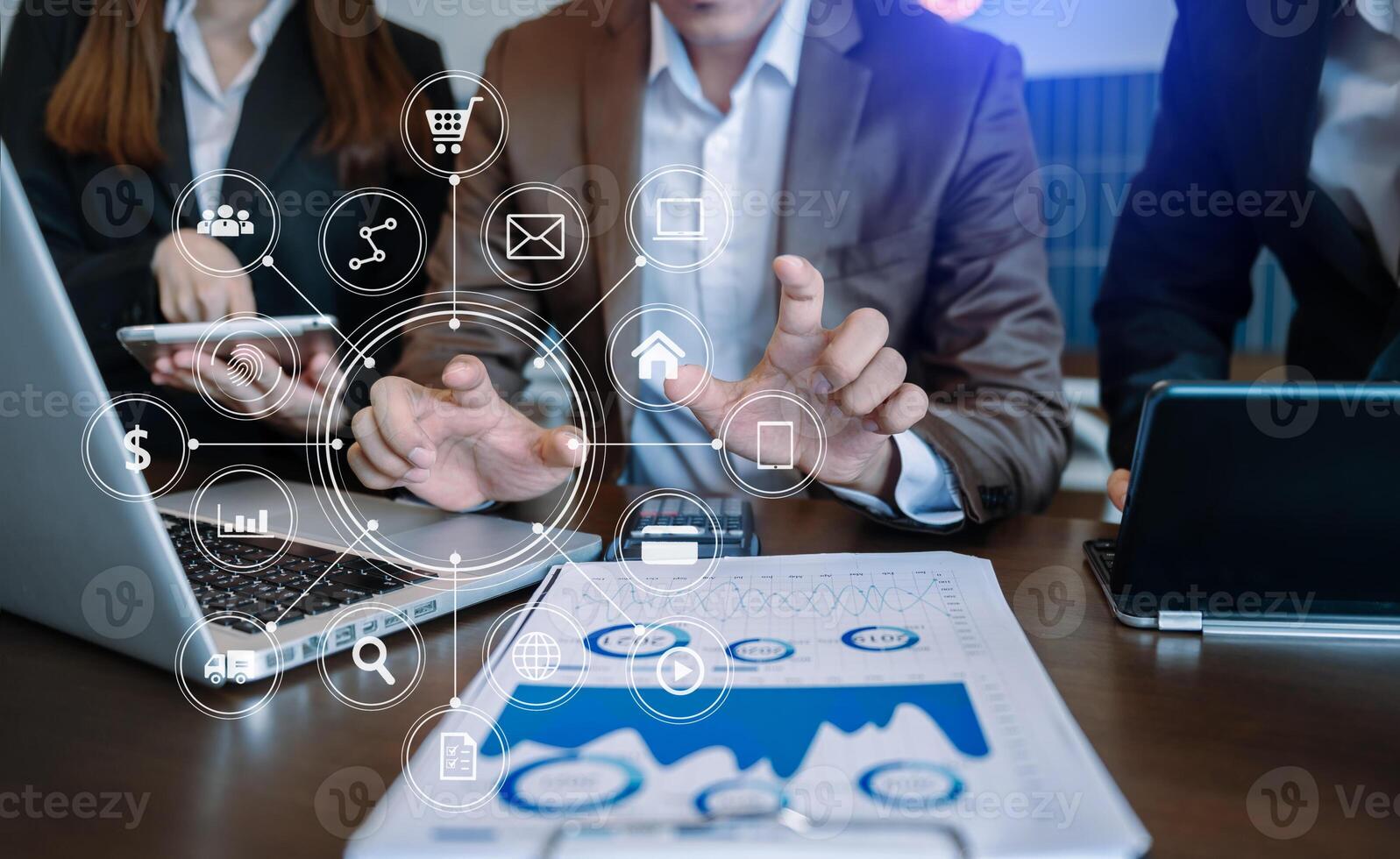 Business team partnership meeting concept. Business hand using laptop, tablet and smartphone  in office. Digital marketing media mobile app in virtual icon screen photo