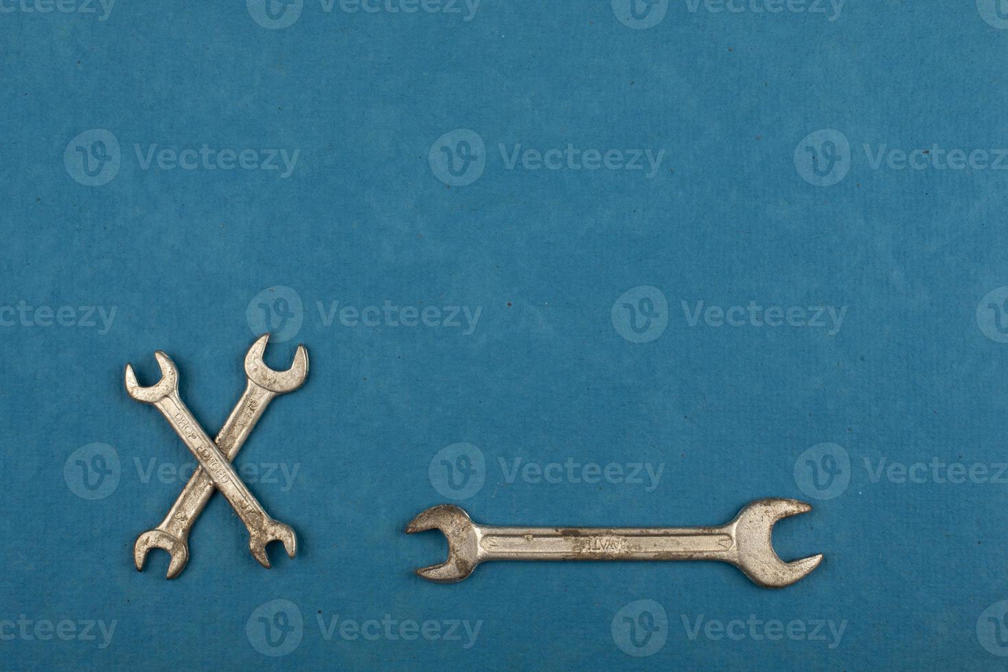 Set of tools on blue background as labour day background photo
