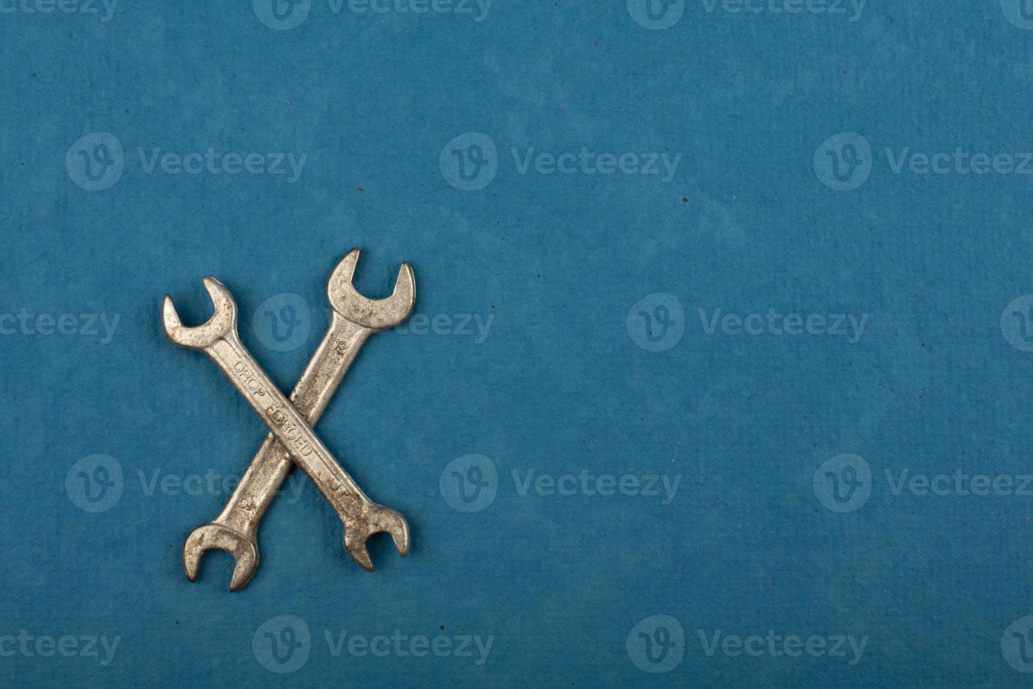 Set of tools on blue background as labour day background photo