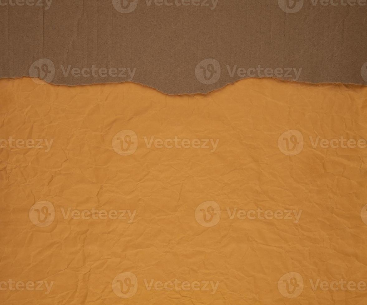 Cardboard torn edge on handmade paper background photo