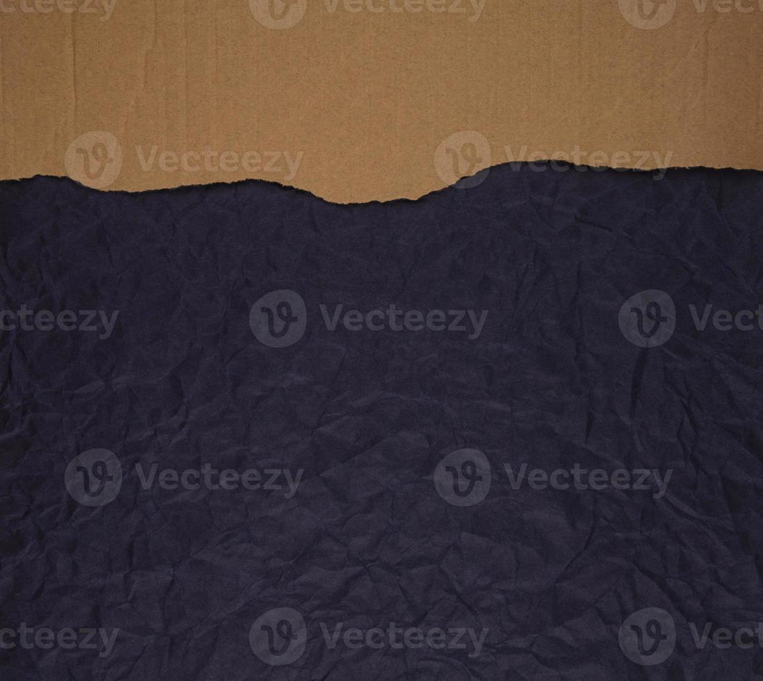 Cardboard torn edge on handmade paper background photo