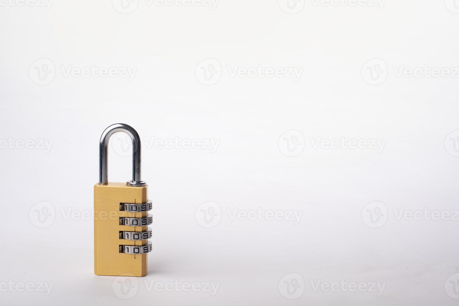 Golden combination lock isolated on white background photo