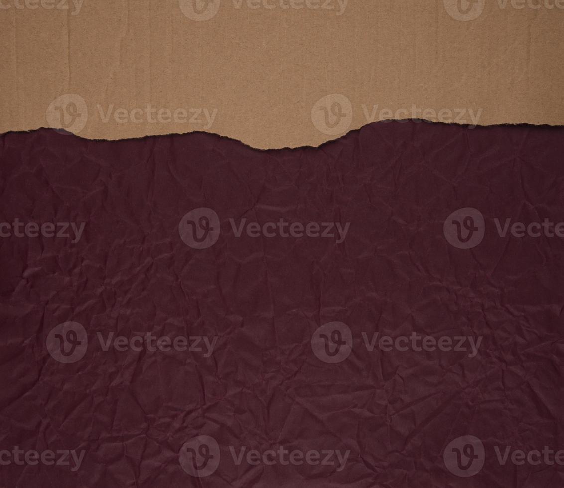 Cardboard torn edge on handmade paper background photo