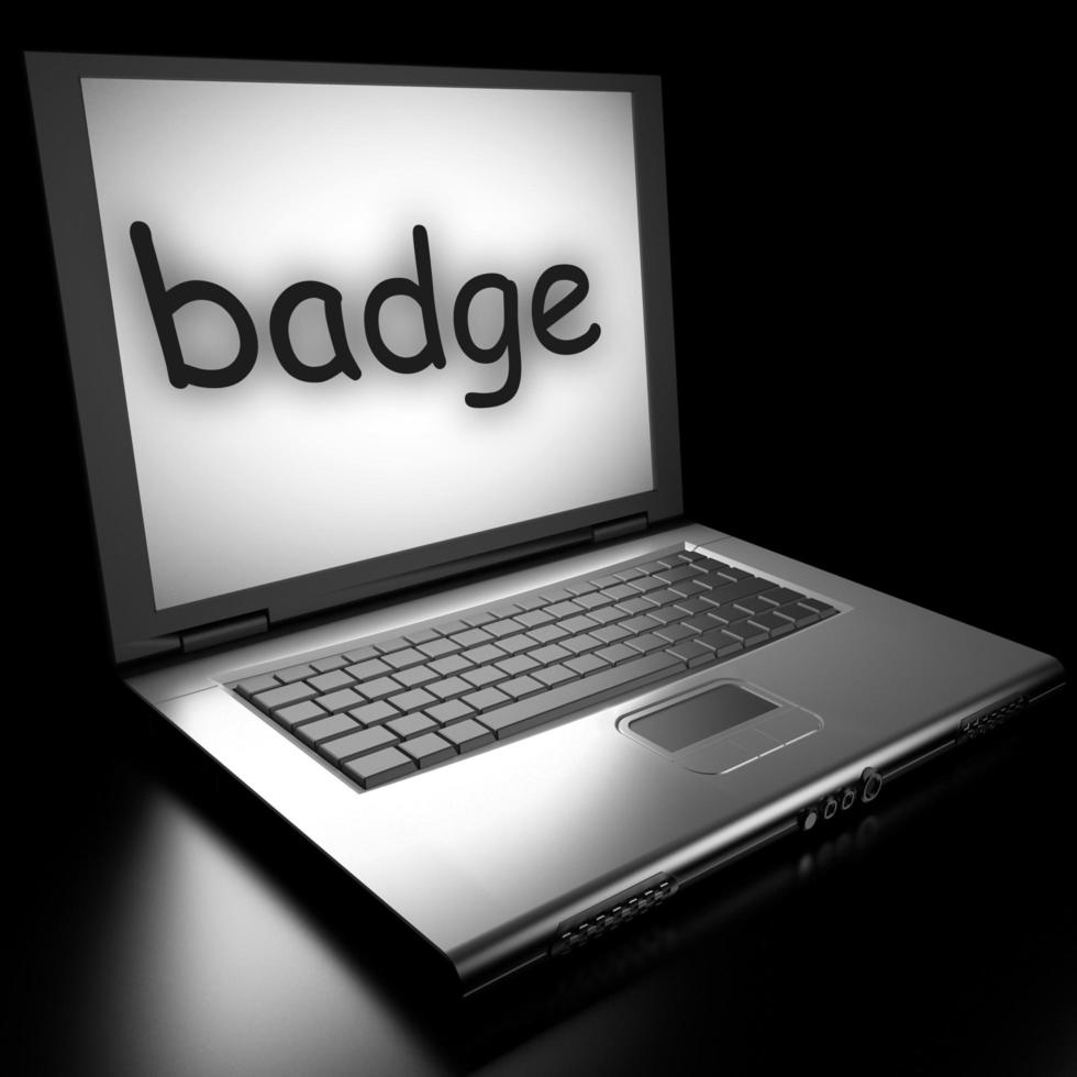 badge word on laptop photo