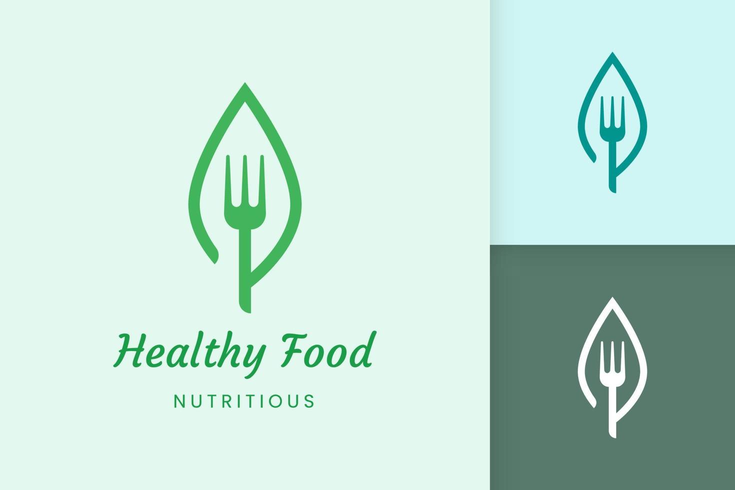 logo de comida saludable con forma de tenedor y hoja vector