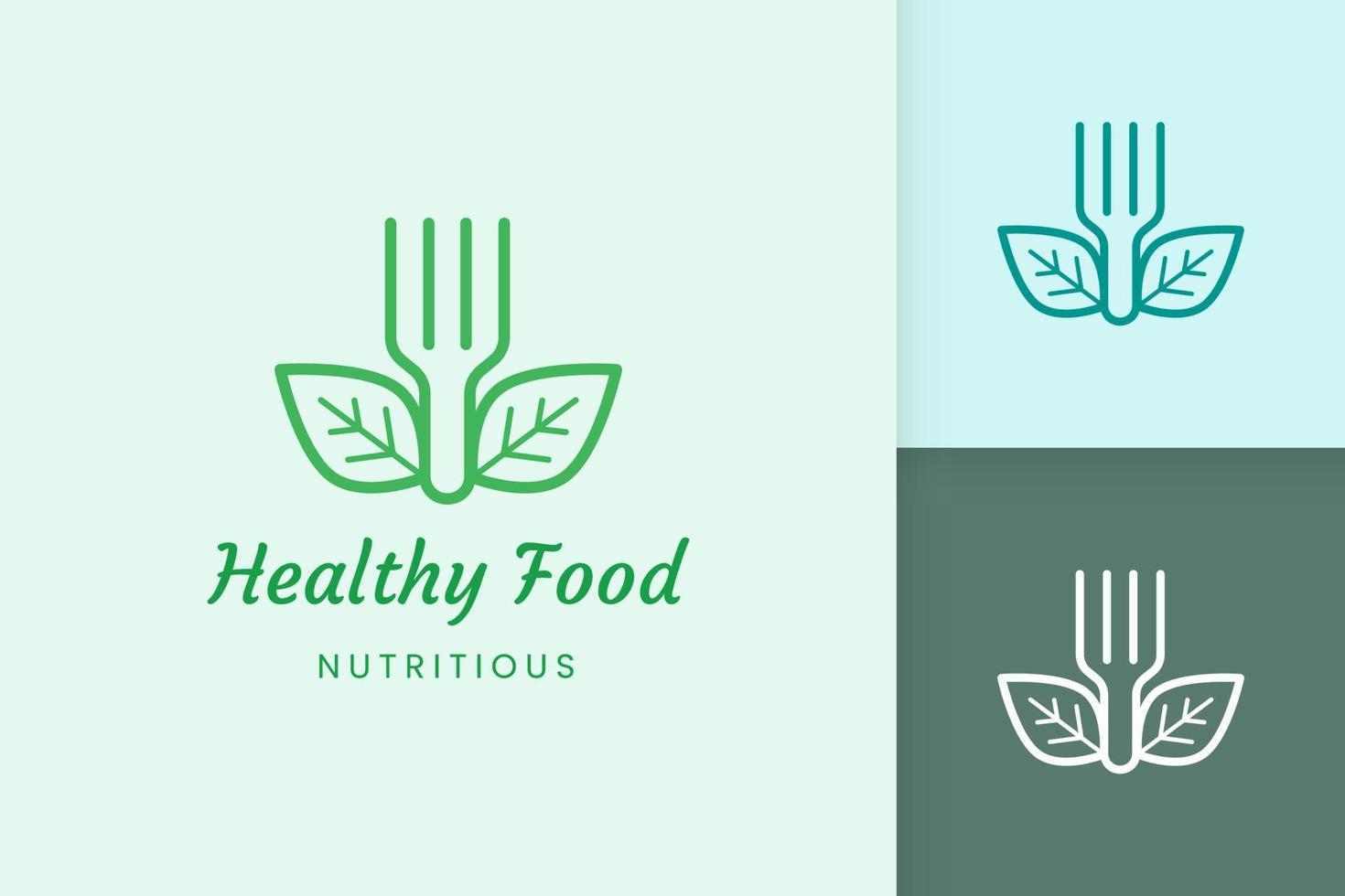 logo de comida saludable con forma de tenedor y hoja vector