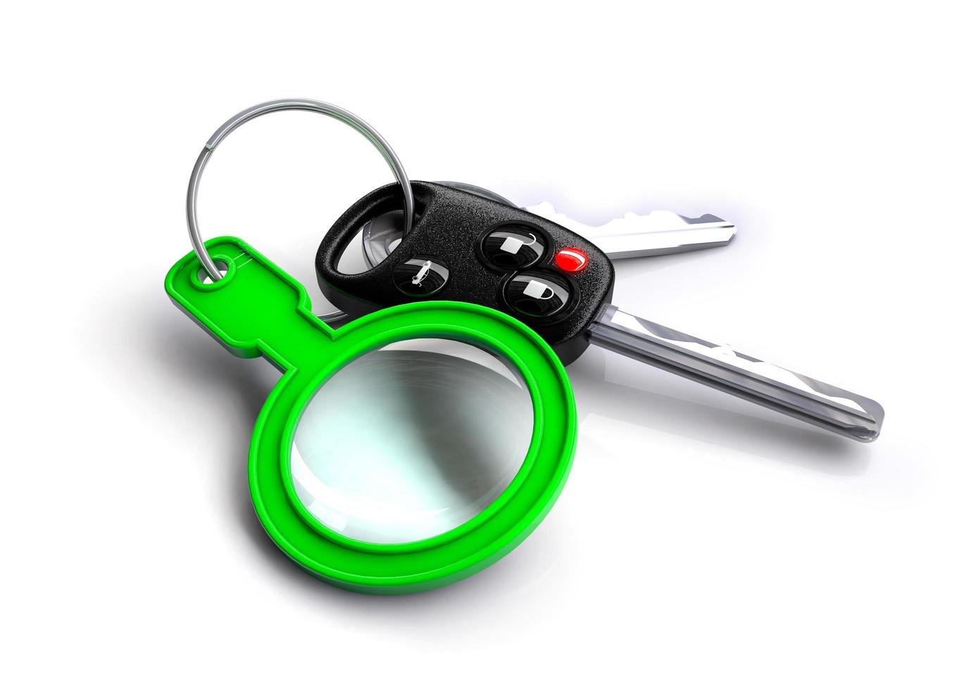 Car keys with a green magnifying glass as a keyring photo