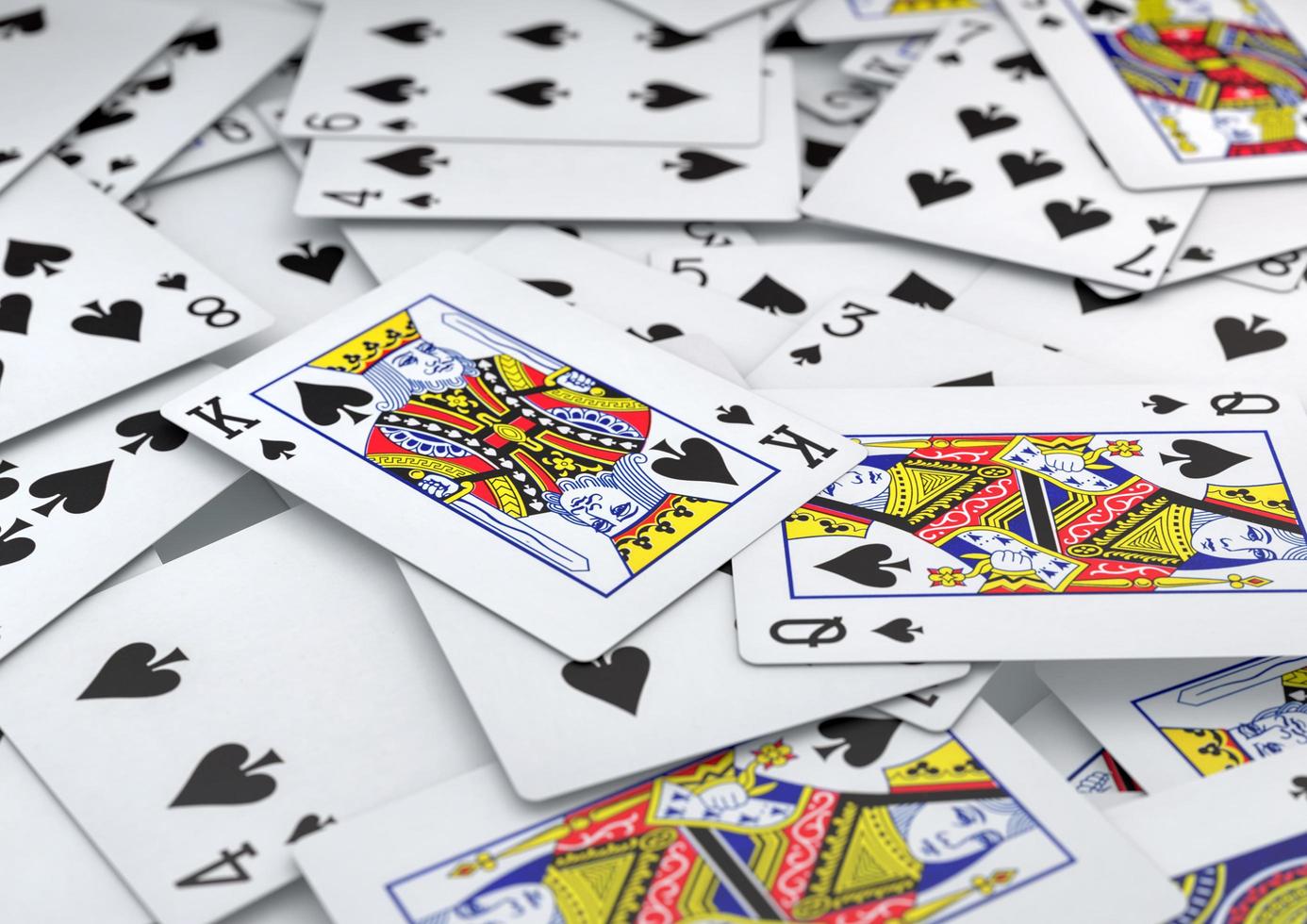 Pile of playing cards spades suite lying on table photo