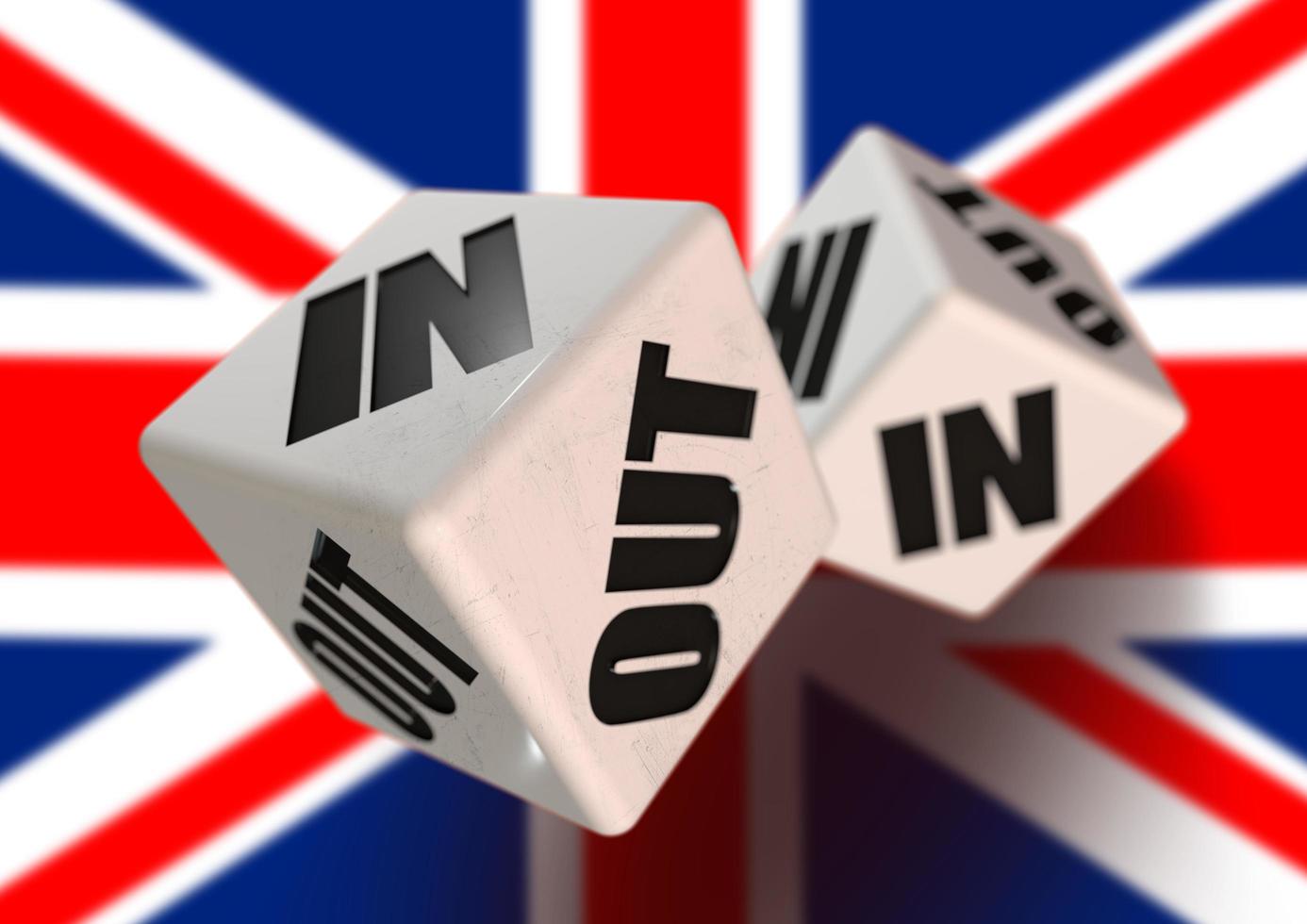 In or Out vote on dice for countries leaving the European Union with flag in the background. photo