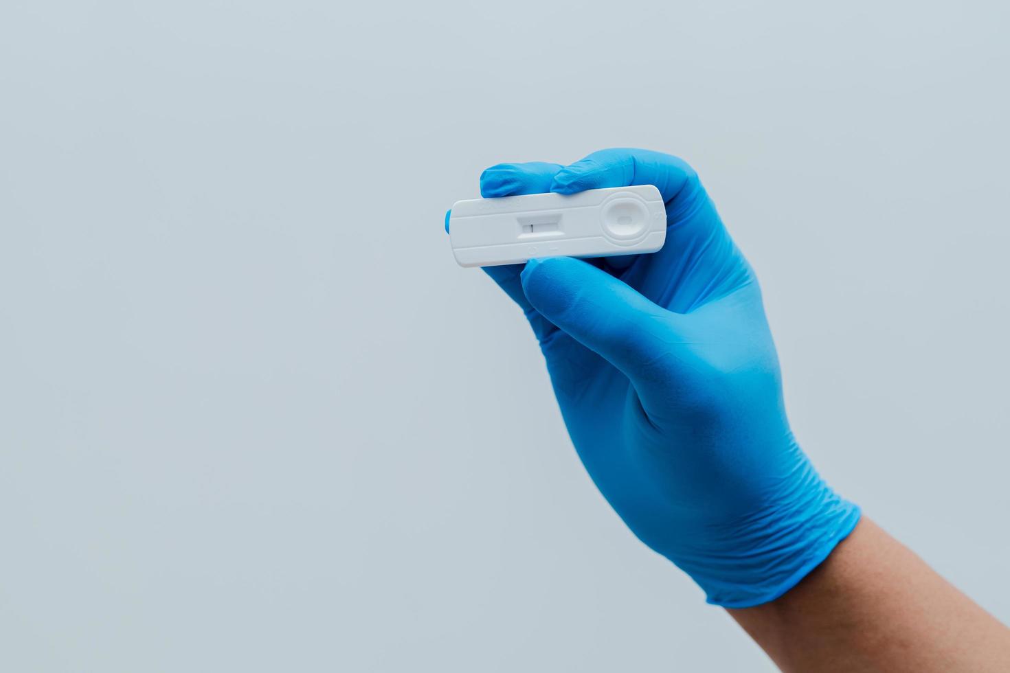 Own hand showing Covid-19 negative test result with SARS CoV-2 Rapid antigen test kit photo