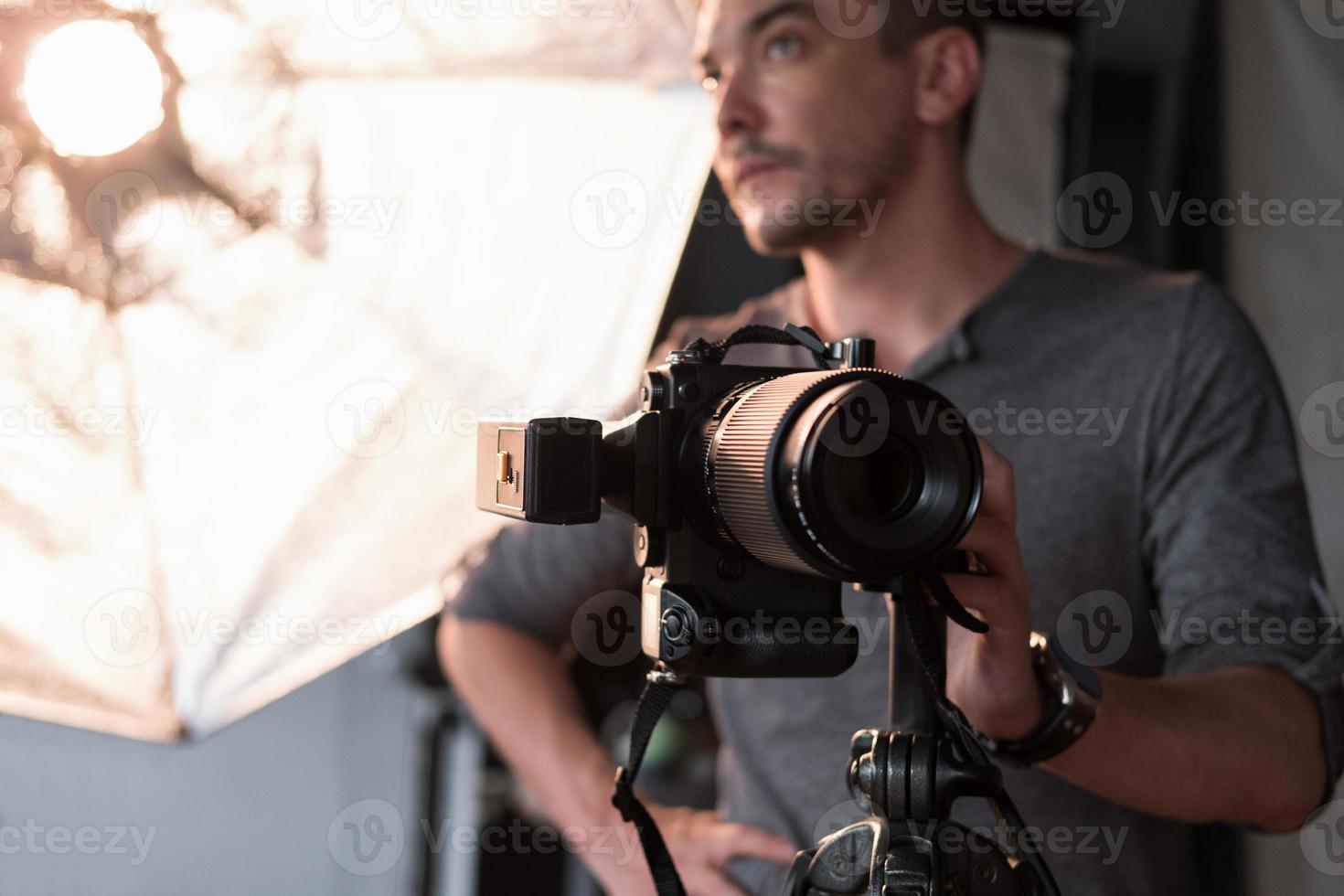 photographer in the process of shooting in the Studio photo