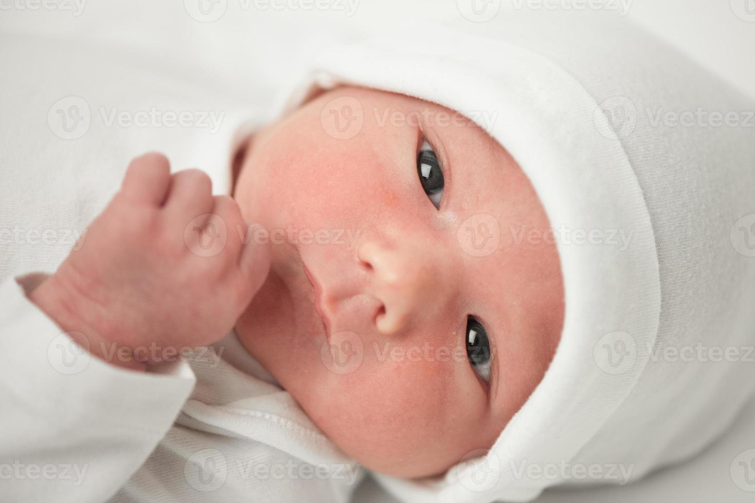 face baby in a white hat photo