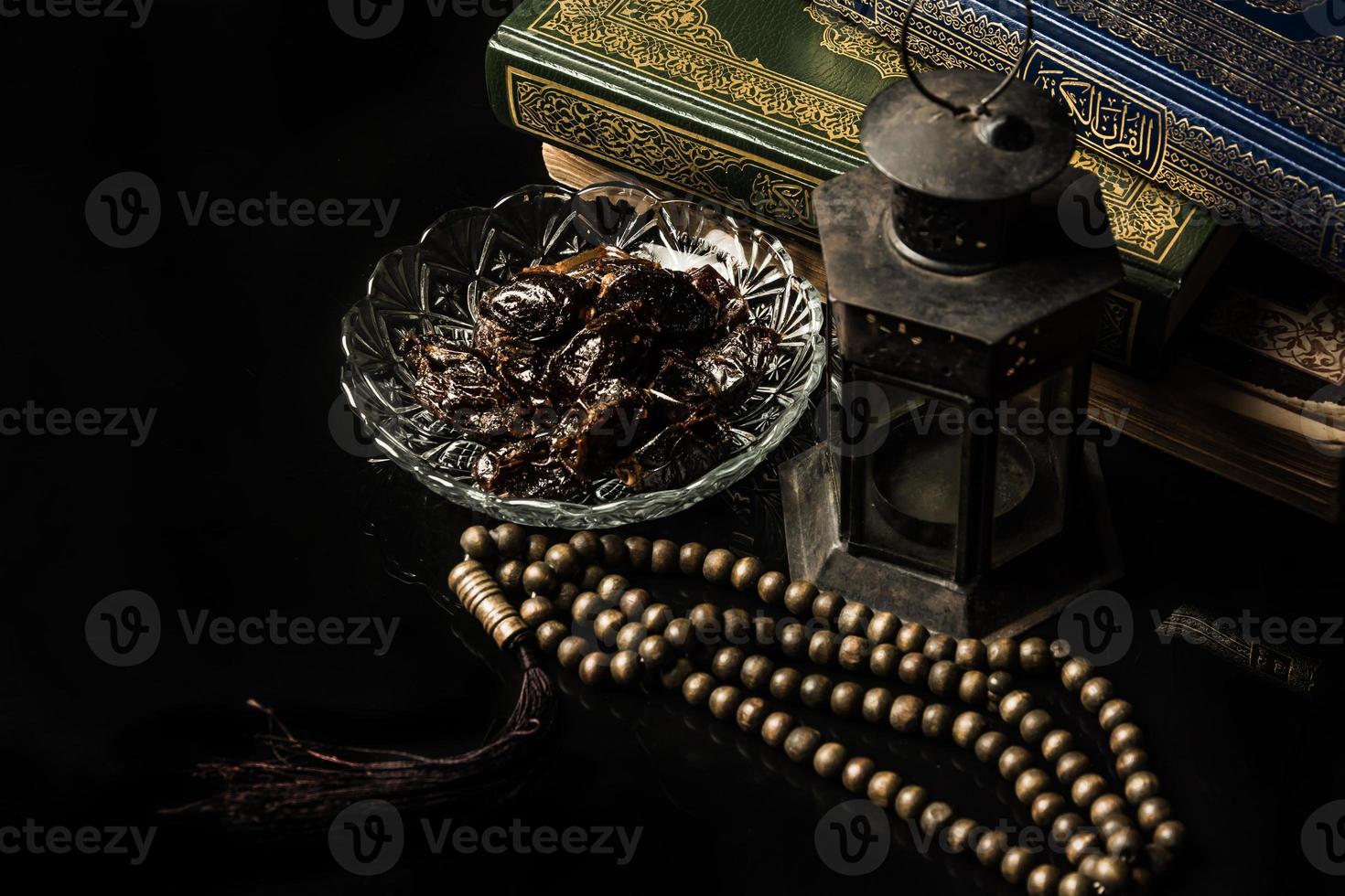 prayer beads with date palm on black background photo