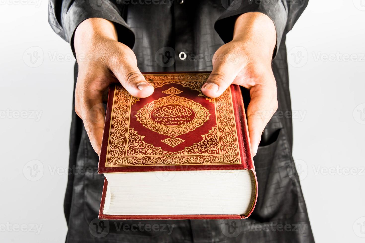 Koran in hand  holy book of Muslims  public item of all muslims photo