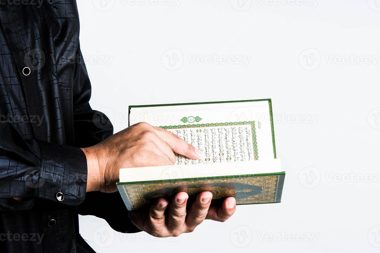 Koran in hand  holy book of Muslims  public item of all muslims photo