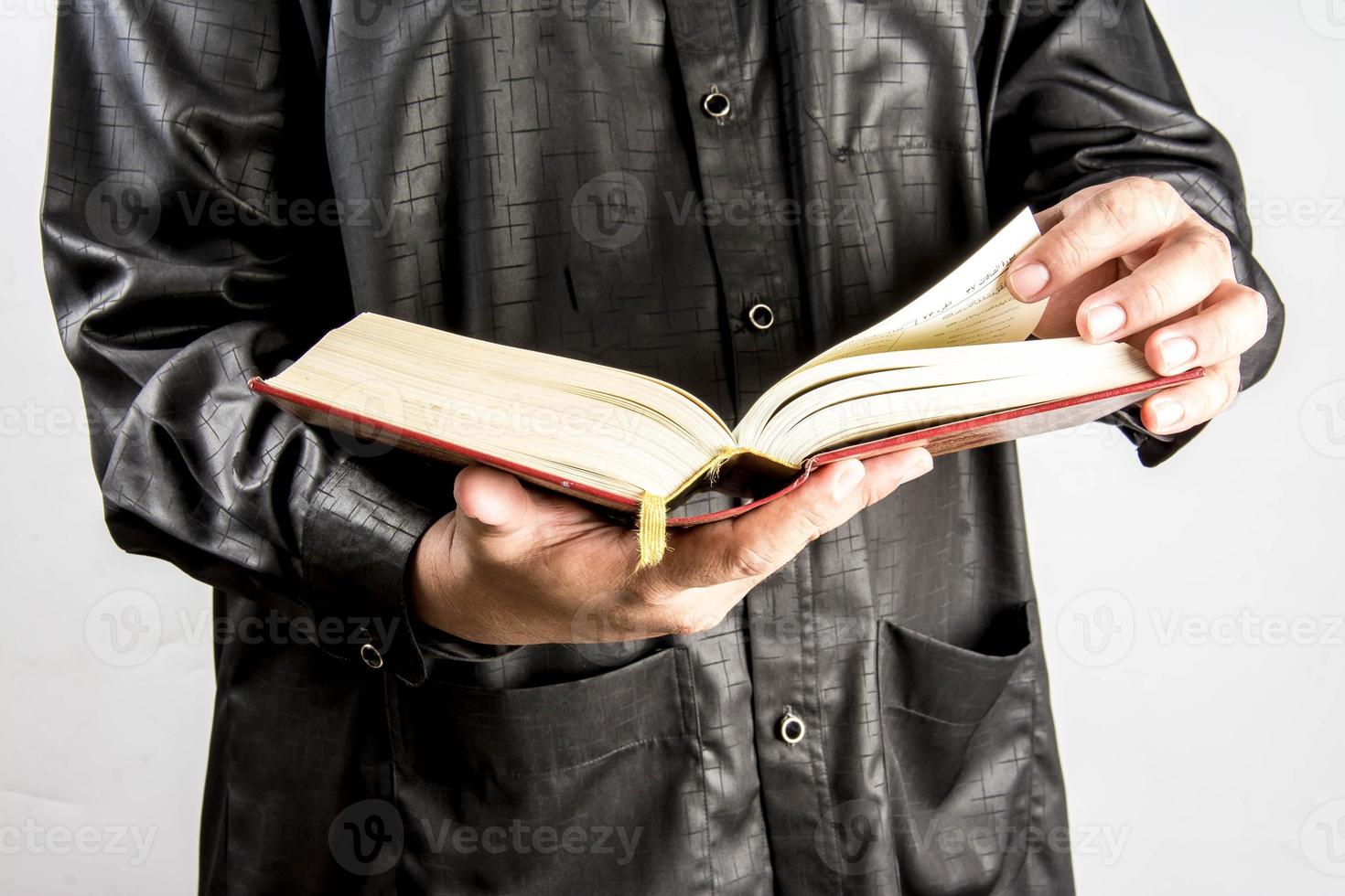 Koran in hand  holy book of Muslims  public item of all muslims photo